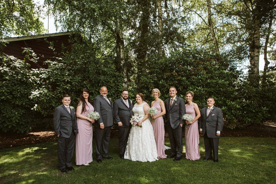 Bridal party with tree grove
