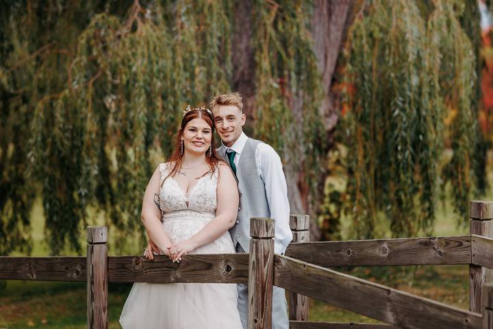 Bride and groom on bridge