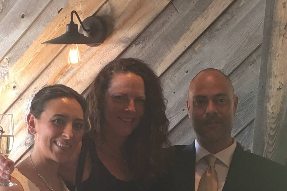 Couple with the officiant