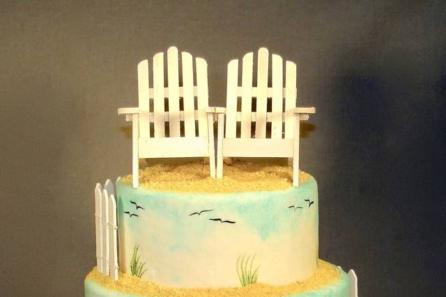 Beach themed wedding cake with hand painted birds and