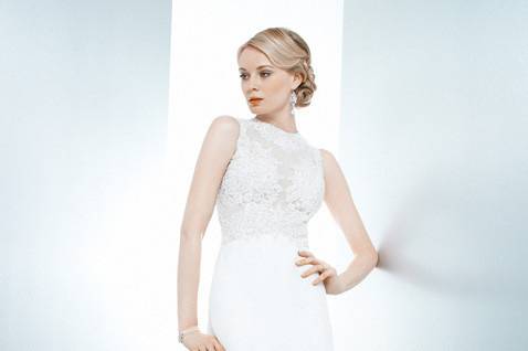 Lunette:
Frame your curves in this shining silk charmeuse gown.  From the flattering V-neck with on-the-shoulder straps, hourglass seaming wraps around to highlight the gracefully draped cowl back.  Beautiful beading and a modified chapel length train complete the picture.  White and off-white