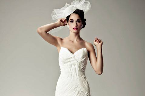 Lexie:
Stop traffic in this festive and elegant staplers trumpet gown. The staplers bodice is elaborately beaded over alençon lace and is finished in a modified chapel-length train of tulle. White and off-white.