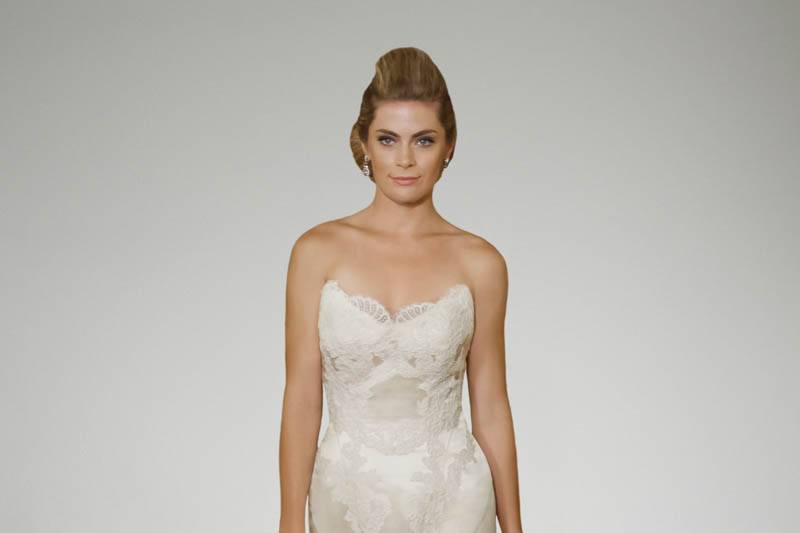 Style Clara <br>      	Equally as desirable as her sister gown, Katherine, the luxuriant sweetheart neckline, delicate cap sleeves, and natural waist bodice are lavishly appointed with a mixture of beaded floral embroidery, lace and textured details. The back illusion neckline is equally as rich