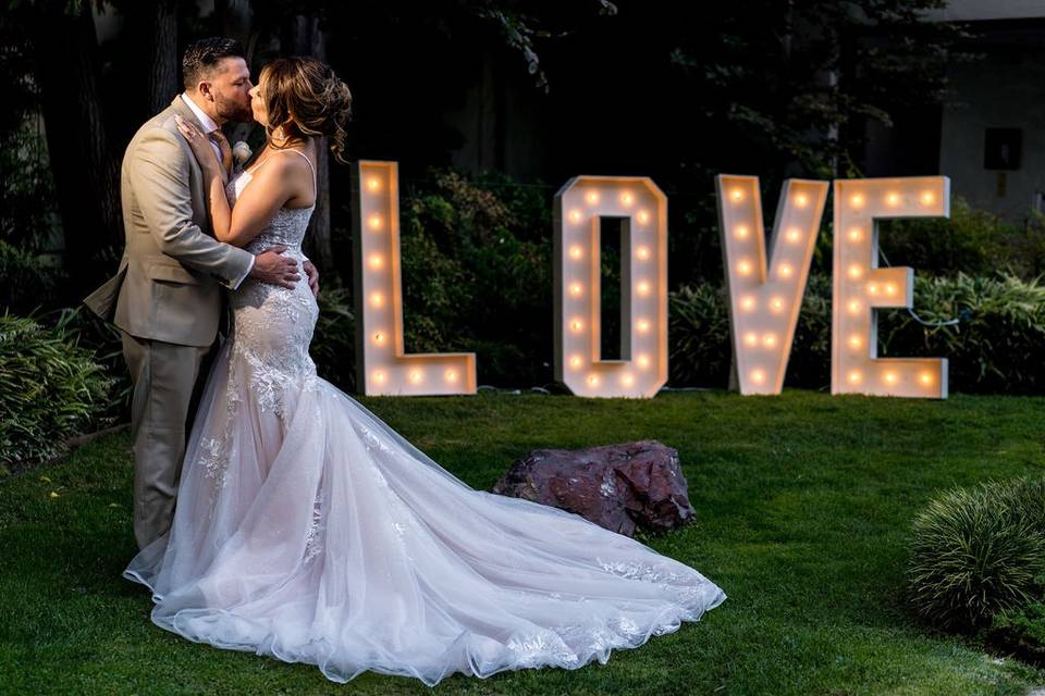 Happy couple with Love sign