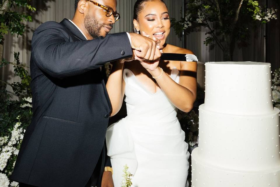 Bride & Groom Eating Cake