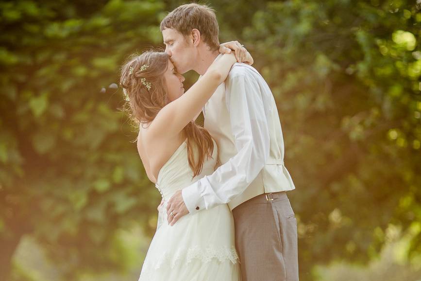 Couple kissing in field