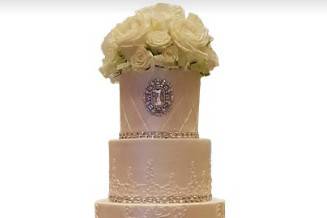 Wedding cake with bouquet on top