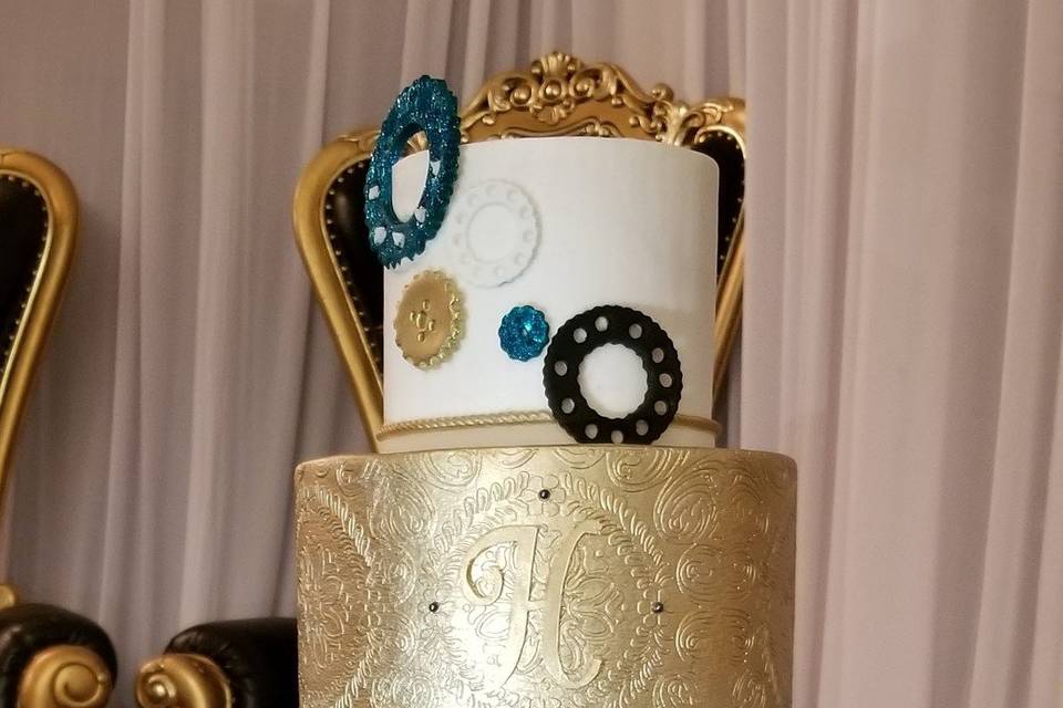 Black, blue, gold, and white cake