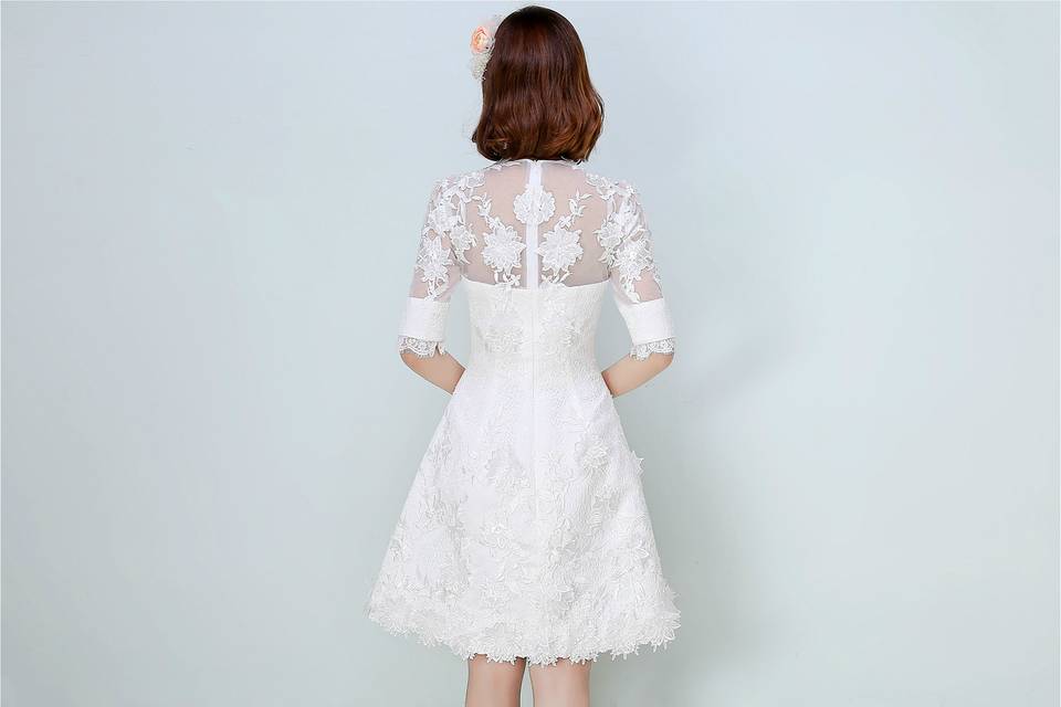 This beaded little daisy floral lace dress is a creation of opulence with romanticism, and celebrates the strength and sensuality of brides in love. The knee-length skirt will perfectly show out the legs of our brides. The illusive neck, sleeves and back design offers a lavish mix of beguiling glamour and whimsical fantasy to you.