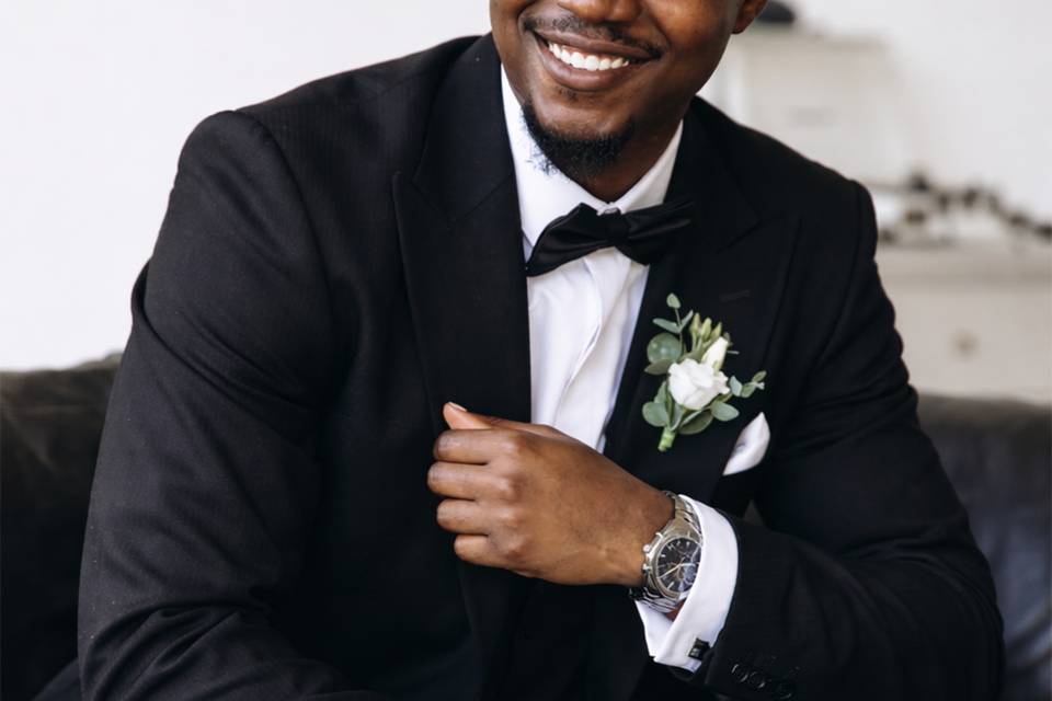 Seated in a custom tuxedo