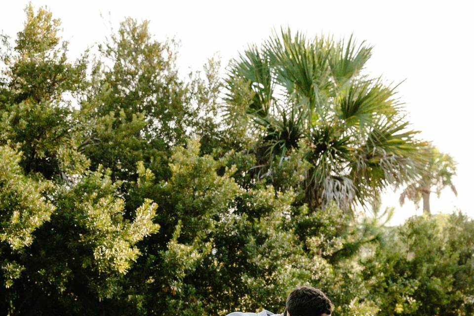 Bride and groom kiss dip