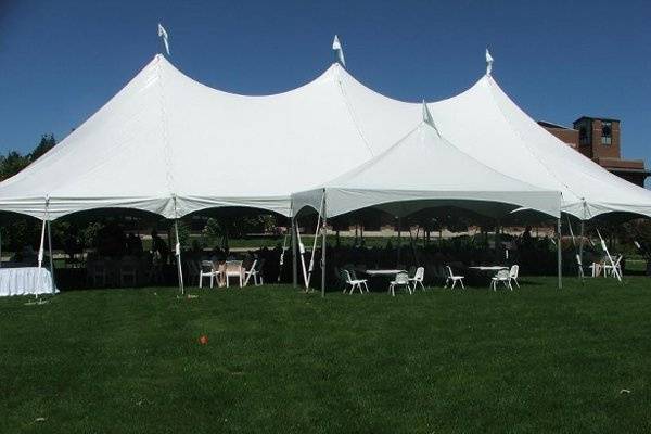 White tents against a blue sky