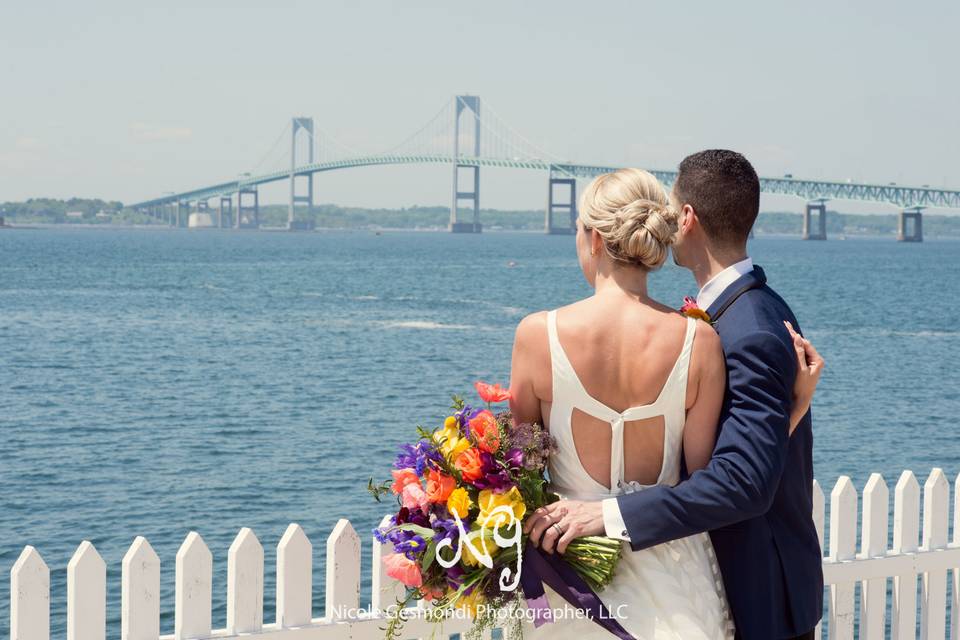 Newlyweds enjoying the view of the Newport Bridge immediately following their first look.