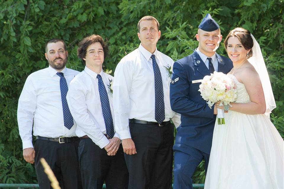 Newlyweds with the groomsmen