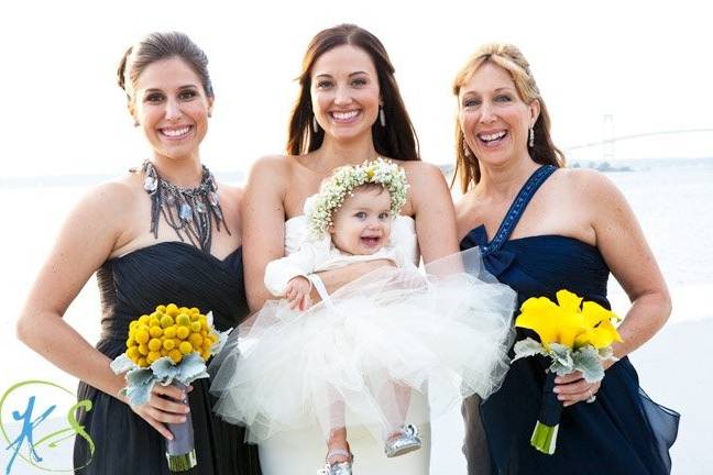 The bride and bridesmaids with the baby