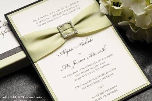 The Elegance Silk Pocket wedding invitation with satin ribbon and crystal buckle from Brenna Catalano Design Studio. Pocket in back to hold insert cards. Comes with box mailer. Colors can be customized.
