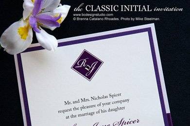 The Classic Initial wedding invitation with double layered backing, satin ribbon and crystal accent from Brenna Catalano Design Studio. Colors and format can be customized.