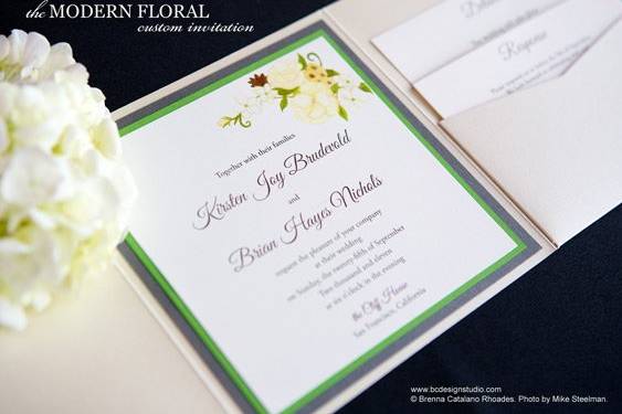 The Modern Floral invitation from Brenna Catalano Design Studio features a hand painted floral motif, double layer backing and pocket to hold insert cards. Comes with front tag with names and date. Colors are customizable.