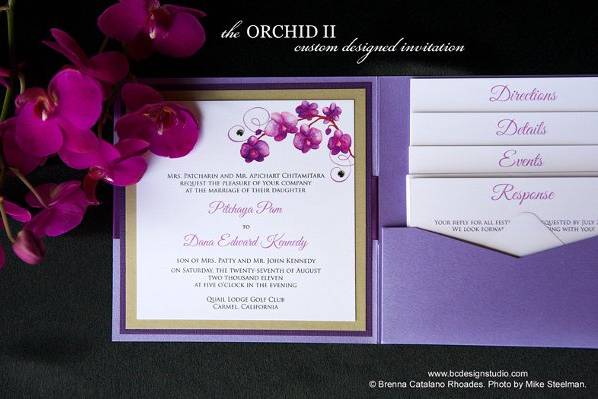 Purple Orchid Wedding Invitation with original painted purple Phalaenopsis Orchid motif by Brenna Catalano Design Studio. Tag on front with names and wedding date. Color and format can be customized.