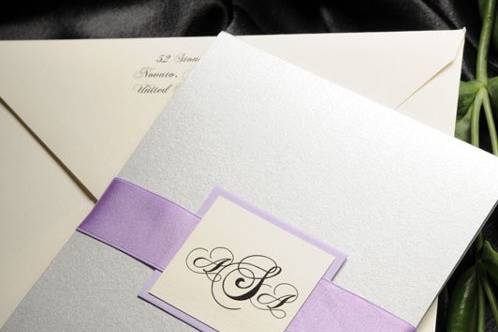 The Classic Monogram wedding invitation with layered backing, satin ribbon and thermography printing from Brenna Catalano Design Studio. Colors and format can be customized.