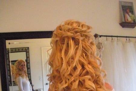 Curly half up, Brides can add length and fullness by incorporating 100% natural clip-in hair extensions can be worn in an up-do, or down.   Custom made by Roseanna to be color matched perfectly to the bride's hair.