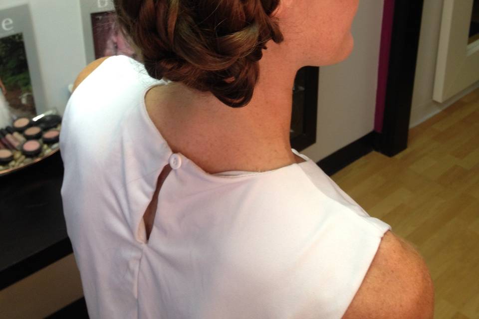 Side swept bun, fullness by incorporating 100% natural clip-in hair extensions.   Custom made by Roseanna to be color matched perfectly to the bride's hair