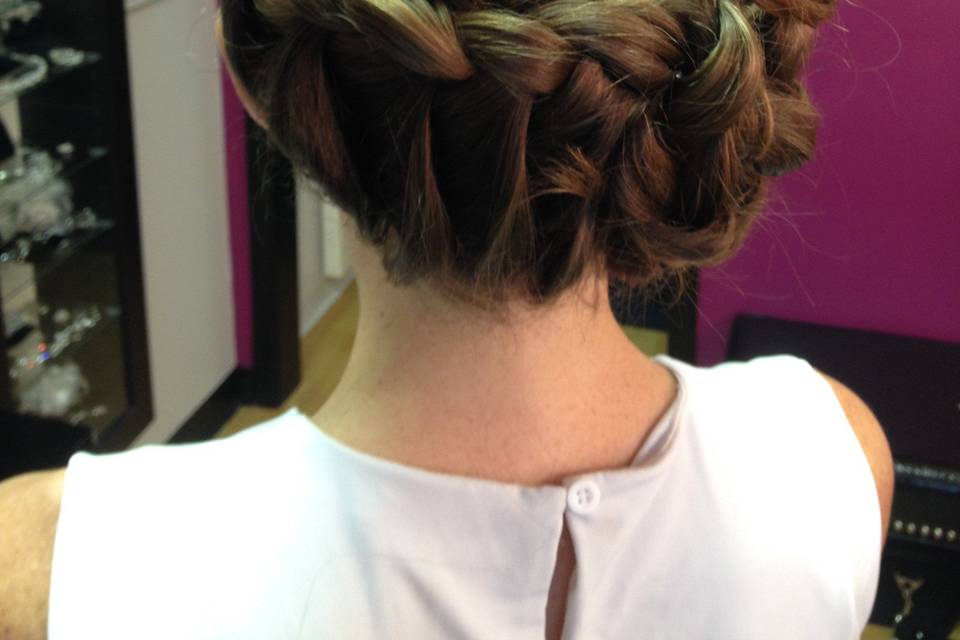 e swept bun, hair extensions incorporated for fullness,