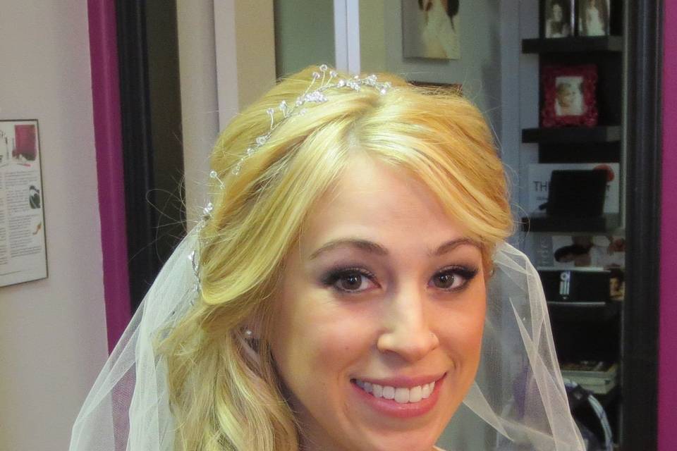 Whimsical, Curled wedding hairstyle, length and fullness by incorporating 100% natural clip-in hair extensions can be worn in an up-do, or down.   Custom made by Roseanna to be color matched perfectly to the bride's hair