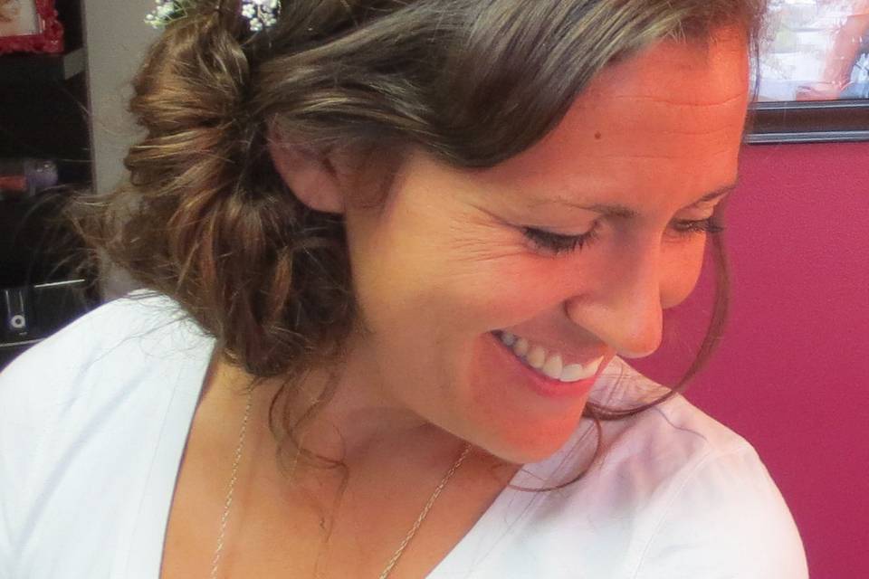 Bohemian wedding hairstyle with a braid,  fullness incorporating 100% natural clip-in hair extensions.   Custom made by Roseanna to be color matched perfectly to the bride's hair