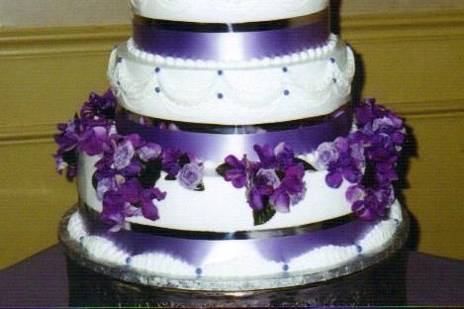 FLORAL FANTASY:  This 3-tier cake is perfect a garden wedding with its drapes of flowers and its simplicity of design.