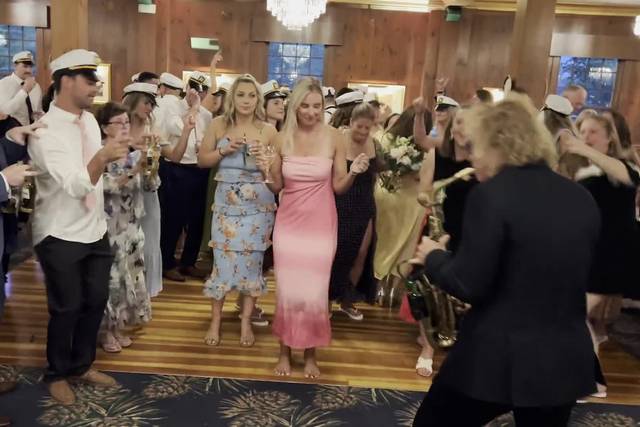 Full reception room, live sax and DJ