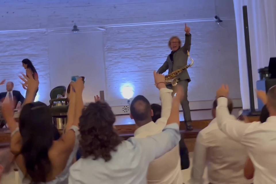 The whole room up and dancing during the live sax set