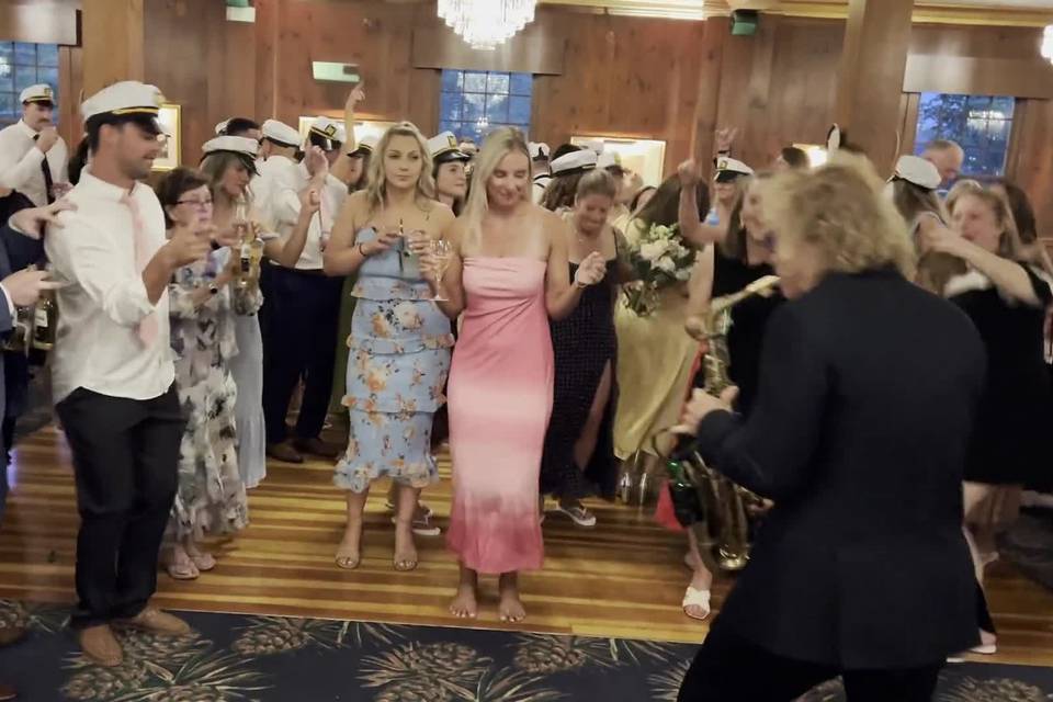 Full reception room, live sax and DJ
