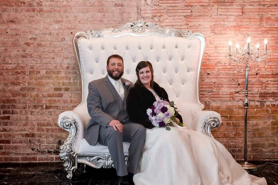 Couple on loveseat throne