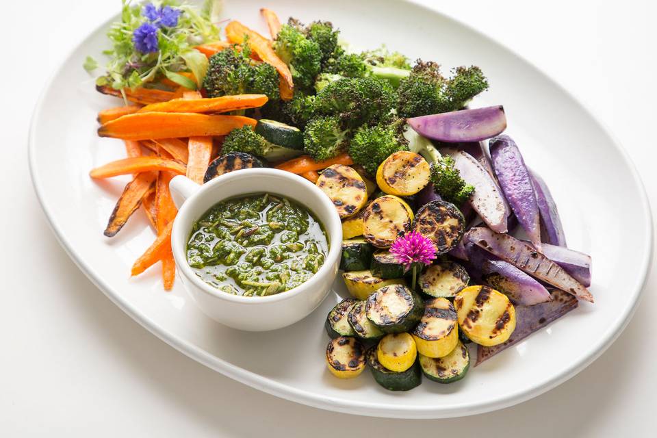Locally grown, organic vegetables lightly roasted and served with sunflower seed pesto