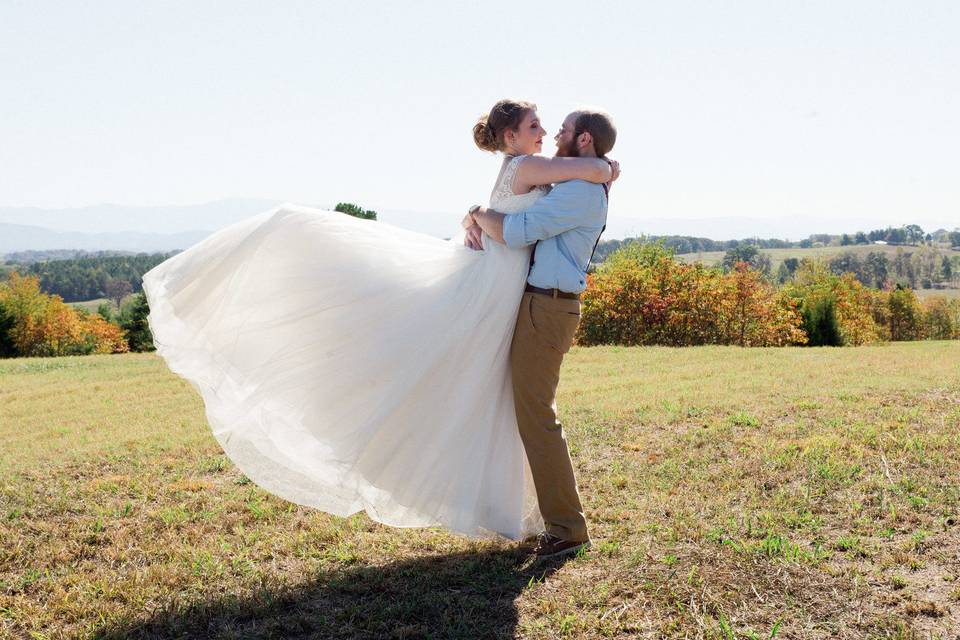 Groom lifts his bride