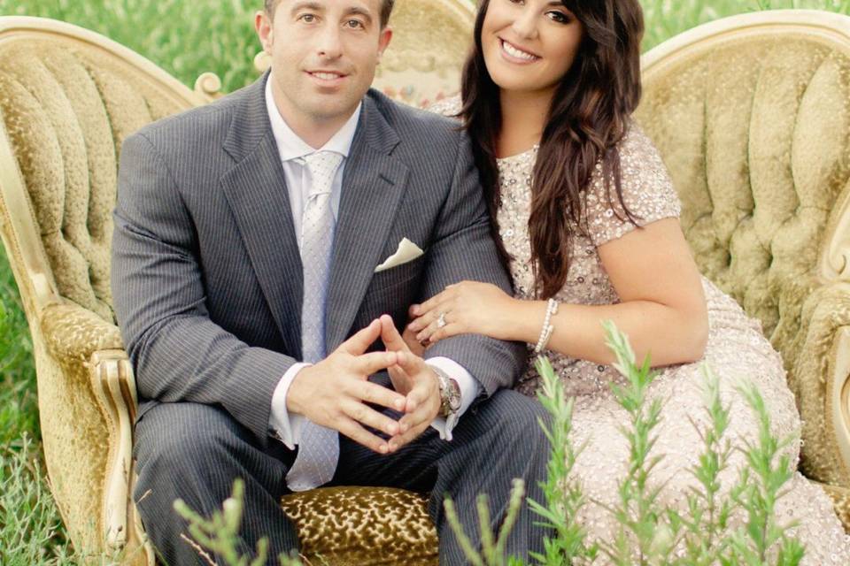 Bride and groom on a chaise lounge