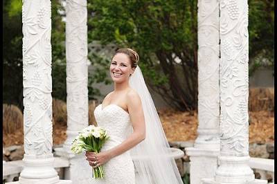 A beautiful bride wearing a lovely Priscilla of Boston gown at Stonebrook Manor in Thornton, CO