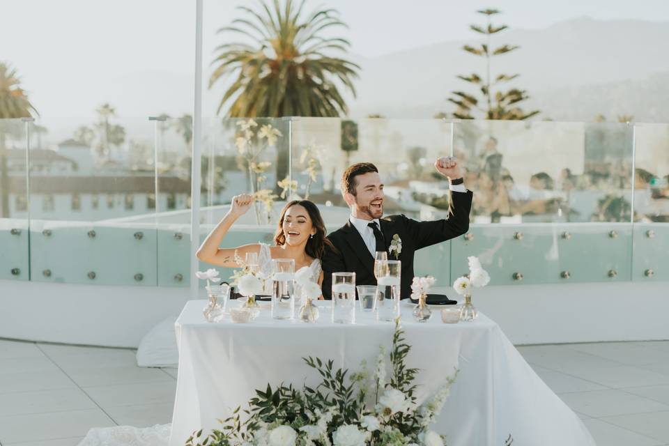 Bride and groom cheer at toast