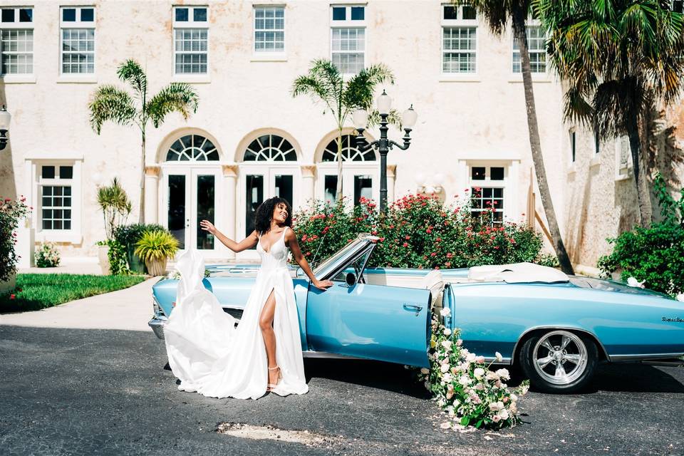 Blue car outside Manor House