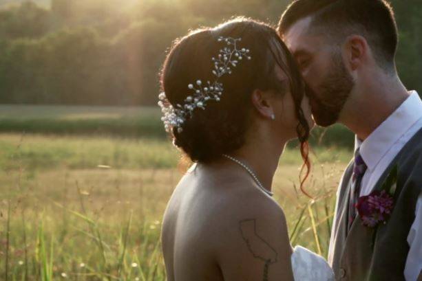 Newlyweds kiss at golden hour