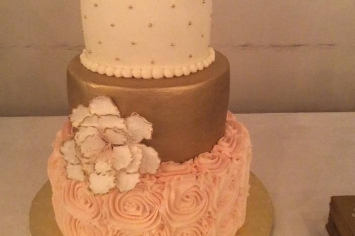 Three tier pink and gold cake