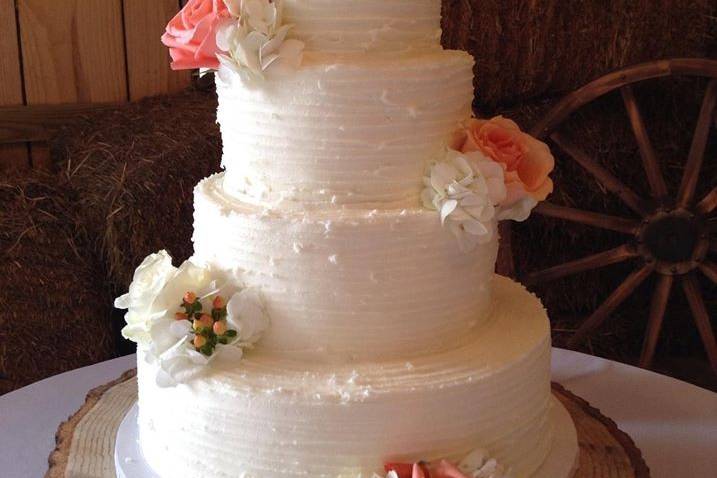 Four tier wedding cake with roses