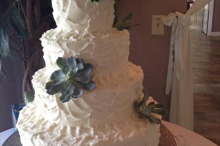 Five tier wedding cake with succulents