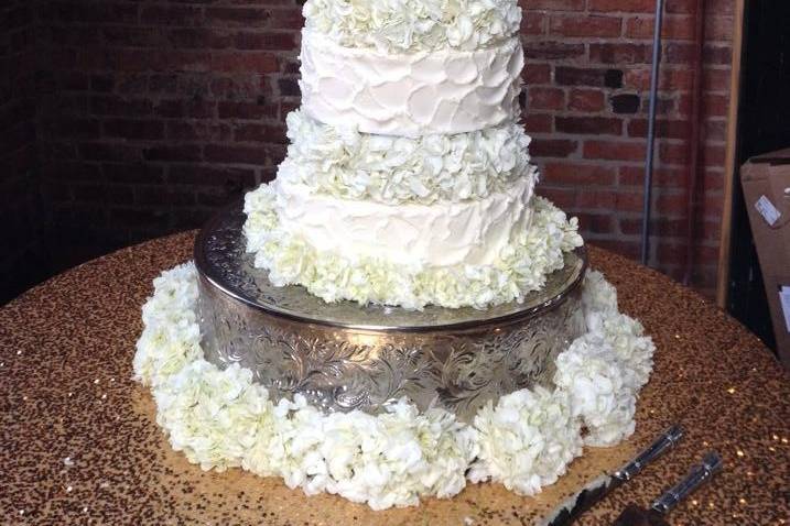 Five tier wedding cake with flowers