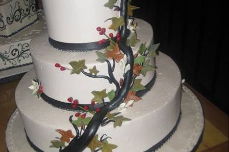 White wedding cake with branch decor