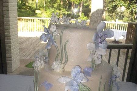 Wedding cake with soft blue flowers