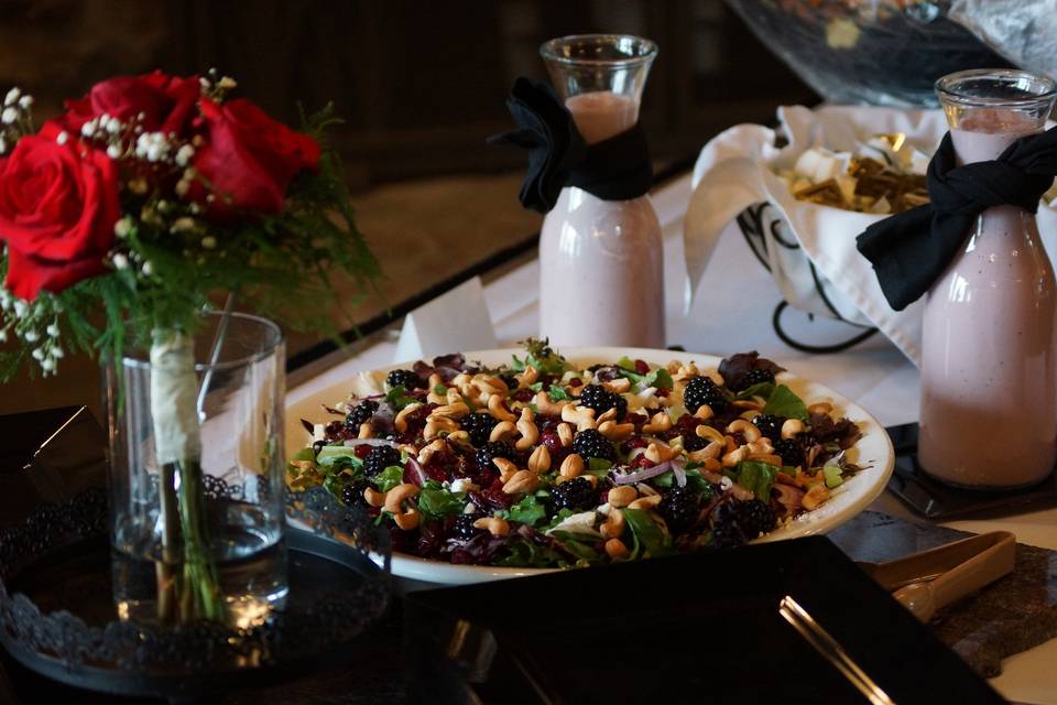 Blackberry feta salad served with blueberry apple cider vinaigrette dressing and fresh baked dinner rolls.