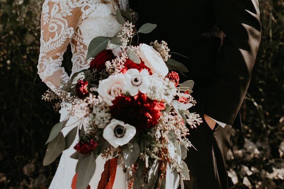 Newlyweds and wedding bouquet