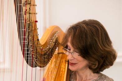 Brenda Street provided upbeat harp music for a wedding cocktail reception at the St. Regis Hotel